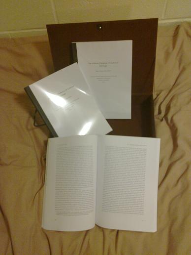 Three copies of my thesis in soft bindings